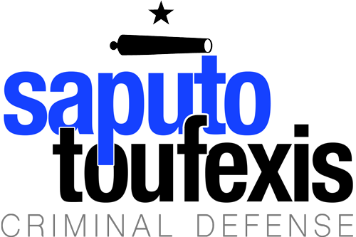 The Saputo Toufexis | Criminal Defense logo featuring the Texas five point star over a canon